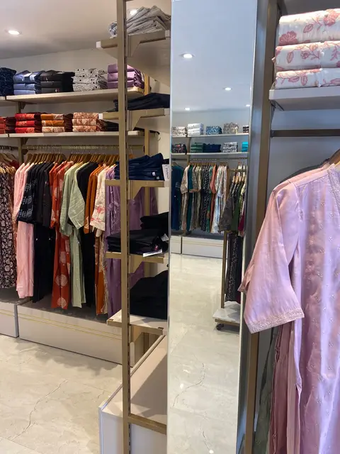 Garment rails, open shelving and a full-height mirror