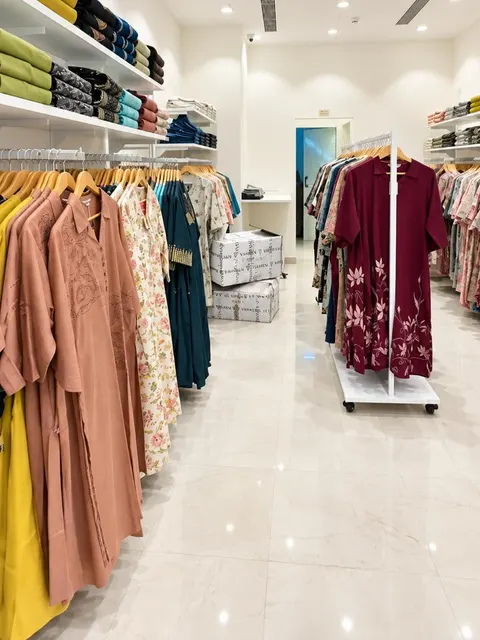 Garment rails and a mobile rail on marble-finish flooring